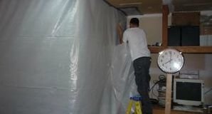 Water Damage Tech Sealing In Mold With Vapor Barrier